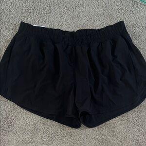 Black Athletic Shorts with Elastic Waistband and Curved Hem